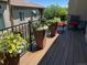 Sunny balcony adorned with vibrant potted flowers, providing a serene outdoor retreat at 16323 River Haven Way, Morrison, CO 80465