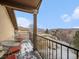 This balcony features metal railing, metal seating, and a view of the landscape at 16323 River Haven Way, Morrison, CO 80465
