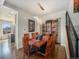 Inviting dining room features hardwood floors, a modern chandelier, and a stylish display cabinet at 16323 River Haven Way, Morrison, CO 80465