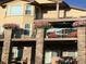 Exterior view of balconies on a home with stone columns and flower planters at 16323 River Haven Way, Morrison, CO 80465