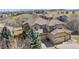 Charming two-story house with a three-car garage, well-maintained lawn, and inviting curb appeal at 16323 River Haven Way, Morrison, CO 80465