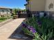 Charming landscape design featuring stone walkway and colorful blooms at 16323 River Haven Way, Morrison, CO 80465