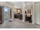 Bright living room featuring a stone fireplace, plush seating, and sliding glass door to the backyard at 16323 River Haven Way, Morrison, CO 80465