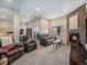 Comfortable living room featuring a stone fireplace and plush seating, bathed in natural light at 16323 River Haven Way, Morrison, CO 80465