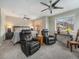 Serene bedroom with mountain views, ceiling fans, reading chairs, and a king-sized bed at 16323 River Haven Way, Morrison, CO 80465