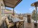Covered outdoor patio with comfortable seating, perfect for dining and enjoying the scenery at 16323 River Haven Way, Morrison, CO 80465