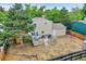 Large backyard featuring a wooden deck, mature tree, and privacy fence at 4848 S Pitkin Way, Aurora, CO 80015