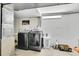 This basement laundry room includes a washer and dryer, plus ample storage space at 4848 S Pitkin Way, Aurora, CO 80015