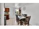 This cozy dining room is attached to the kitchen, featuring a table for six at 4848 S Pitkin Way, Aurora, CO 80015
