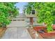 This home has a well-maintained front exterior, attached garage, and manicured landscaping at 4848 S Pitkin Way, Aurora, CO 80015