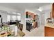 Open kitchen with stainless steel appliances and connecting dining area at 4848 S Pitkin Way, Aurora, CO 80015