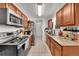 Well-equipped kitchen featuring granite countertops and stainless steel appliances at 4848 S Pitkin Way, Aurora, CO 80015