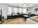 Spacious living room featuring hardwood floors and a dark colored sofa at 4848 S Pitkin Way, Aurora, CO 80015