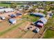Aerial view of the property highlighting its large shop, barn, pens, and yard areas at 14347 E 134Th Ave, Brighton, CO 80601