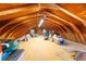 Spacious attic with wood beams and flooring offers ample storage space at 14347 E 134Th Ave, Brighton, CO 80601