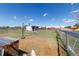 Spacious fenced backyard with a shed, animal pen, and ample room to play on a sunny day at 14347 E 134Th Ave, Brighton, CO 80601
