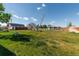 Lush backyard featuring a barn, shed, and plenty of green space for outdoor activities at 14347 E 134Th Ave, Brighton, CO 80601