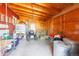 Interior view of a barn featuring hay bales and various farm equipment and supplies at 14347 E 134Th Ave, Brighton, CO 80601
