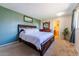 Comfortable bedroom featuring a large bed and ensuite bathroom at 14347 E 134Th Ave, Brighton, CO 80601