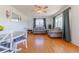 Cozy living room boasts hardwood floors, neutral paint, and windows providing natural light at 14347 E 134Th Ave, Brighton, CO 80601