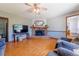 Spacious living room showcasing a stone fireplace and laminate floors at 14347 E 134Th Ave, Brighton, CO 80601