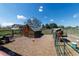 View of a small shed and greenhouse on a rural property with fenced enclosures at 14347 E 134Th Ave, Brighton, CO 80601