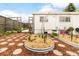 Landscaped backyard with stone pathway and garden beds provides a serene and inviting outdoor space at 1884 S Ivy St, Denver, CO 80224