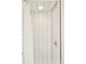 Clean bathroom features white subway tiles, a showerhead, and a solid shower curtain at 1884 S Ivy St, Denver, CO 80224