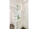 Modern bathroom featuring a glass-enclosed shower, white tile, and a sleek vanity at 1884 S Ivy St, Denver, CO 80224
