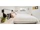 Cozy bedroom with natural light, hardwood floors, and a neutral color palette at 1884 S Ivy St, Denver, CO 80224