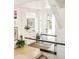 Bright foyer with light wood floors, art display, and natural light at 1884 S Ivy St, Denver, CO 80224