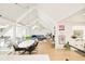 Open-concept living space with high vaulted ceilings and ample natural light at 1884 S Ivy St, Denver, CO 80224
