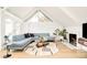 Stylish living room featuring a blue sofa, modern rug, and fireplace at 1884 S Ivy St, Denver, CO 80224