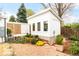 View of a detached outbuilding with lots of light, and a well-landscaped yard at 1884 S Ivy St, Denver, CO 80224