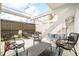 Inviting patio space with comfortable seating, plants, and pergola, perfect for relaxation and gatherings at 1884 S Ivy St, Denver, CO 80224