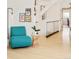 Stylish sitting area by staircase with glass guardrail at 1884 S Ivy St, Denver, CO 80224