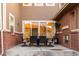 Back patio dining area with seating and an outdoor heater creating a cozy space to eat outside at 27274 E Lakeview Pl, Aurora, CO 80016