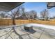 Backyard patio with fire pit and wood fence at 3289 S Eudora St, Denver, CO 80222