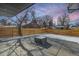 Private backyard with a fire pit and wooden privacy fence at 3289 S Eudora St, Denver, CO 80222