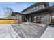 Spacious backyard patio with fire pit and modern wood fence at 3289 S Eudora St, Denver, CO 80222