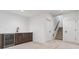 Finished basement with wet bar and carpeted flooring, stairs leading upstairs at 3289 S Eudora St, Denver, CO 80222