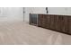 Finished basement with wet bar and carpet flooring at 3289 S Eudora St, Denver, CO 80222