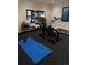 Home gym featuring stationary bike, treadmill, and yoga/Pilates equipment at 3289 S Eudora St, Denver, CO 80222