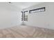 Bright bedroom with carpet flooring and large windows at 3289 S Eudora St, Denver, CO 80222