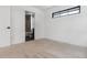 Bedroom with ensuite bathroom and neutral carpeting at 3289 S Eudora St, Denver, CO 80222