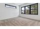 Well-lit bedroom with neutral carpeting and large windows at 3289 S Eudora St, Denver, CO 80222