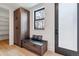 Bright entryway with built-in bench, storage, and access to pantry at 3289 S Eudora St, Denver, CO 80222