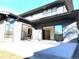 Modern home exterior with gray siding, large windows and a covered patio at 3289 S Eudora St, Denver, CO 80222