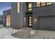 Modern home exterior with gray siding, and a walkway leading to the front door at 3289 S Eudora St, Denver, CO 80222