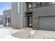 Contemporary home's front entrance with sleek design and gray accents at 3289 S Eudora St, Denver, CO 80222